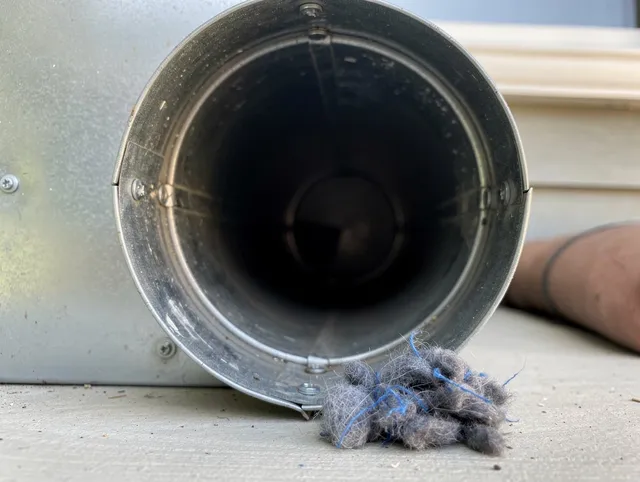 Westlake Dryer Vent Cleaning technician using specialized equipment to clear severe dryer vent blockage in Westlake
